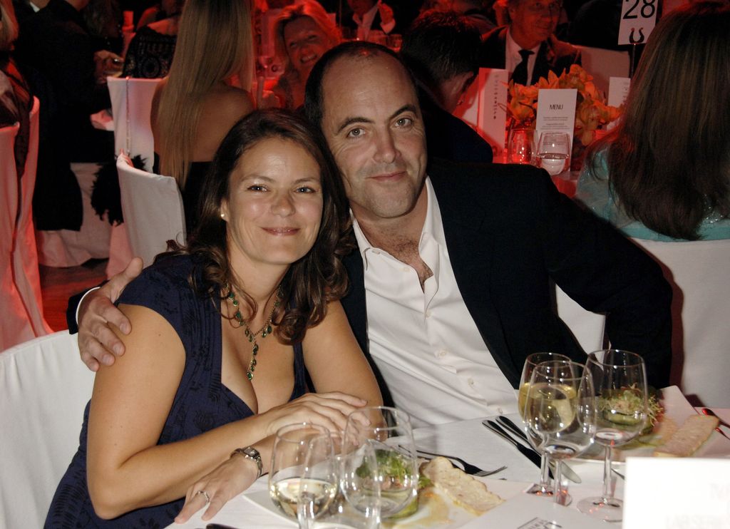 Sonia Forbes-Adam and James Nesbitt sitting at a table with a white tablecloth