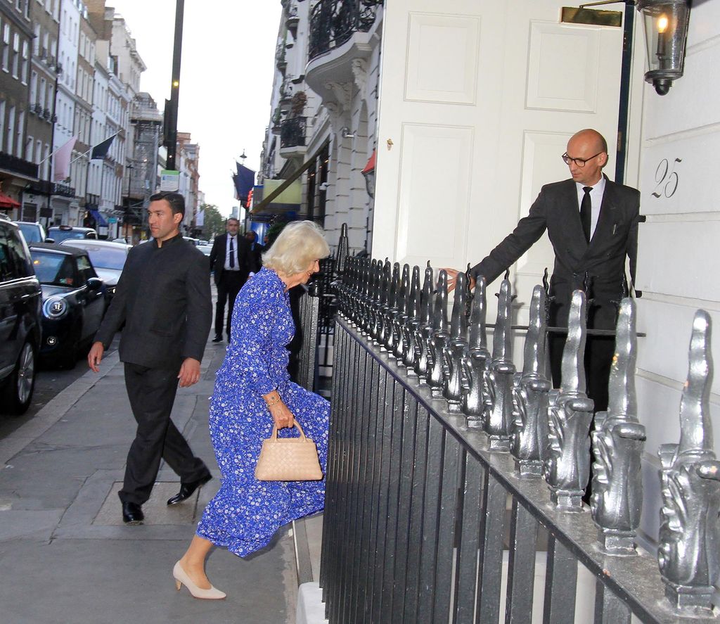 Queen Camilla entering a club