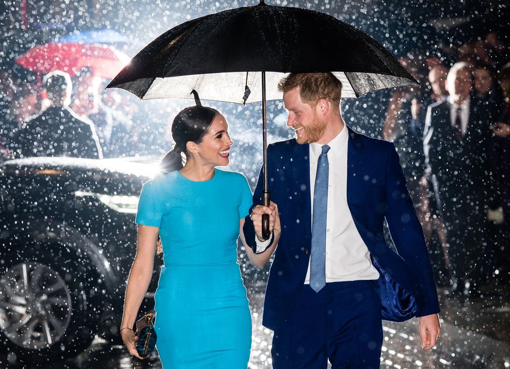 couple with umbrella in rain