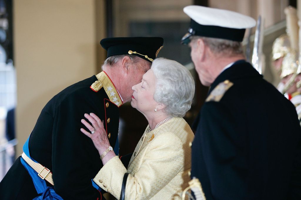 King Harald kisses the Queen in 2005