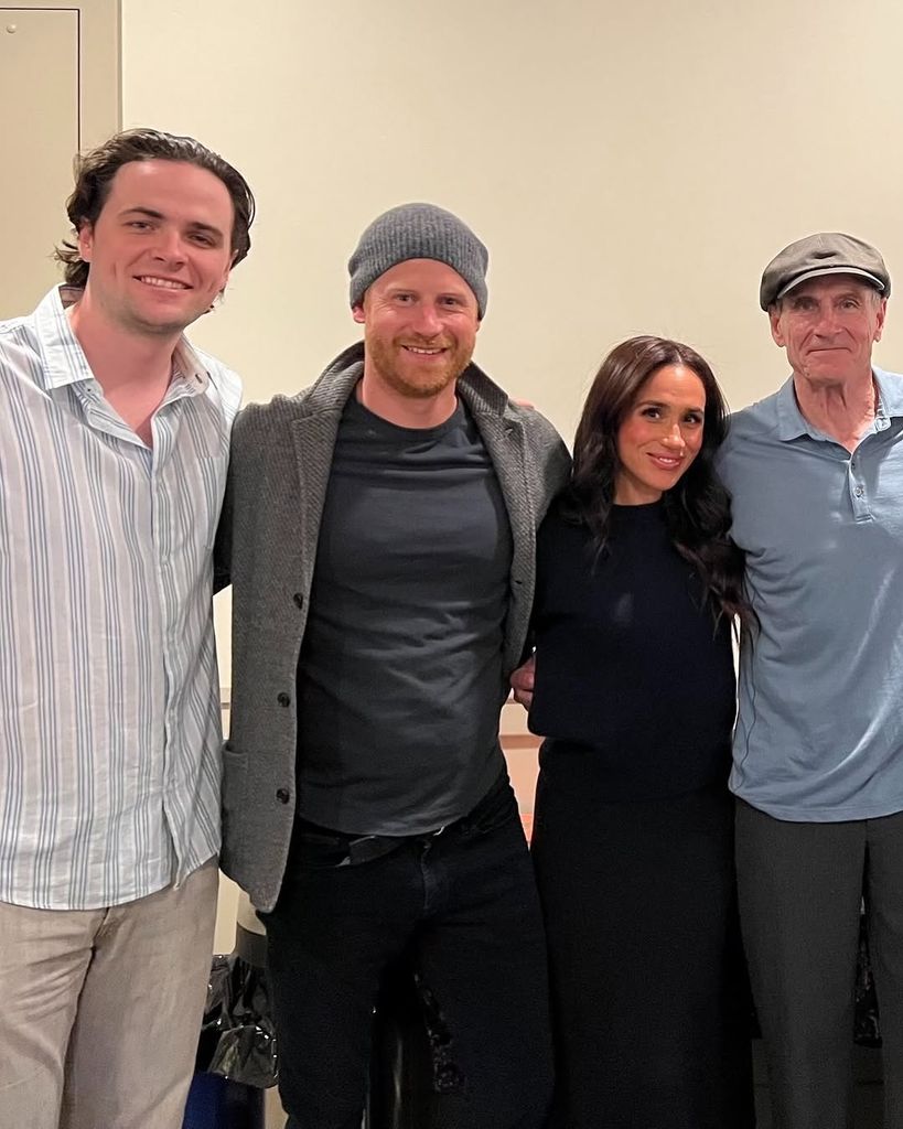 Prince Harry (2L) and Meghan Markle pose with James Taylor ans guest (L) 