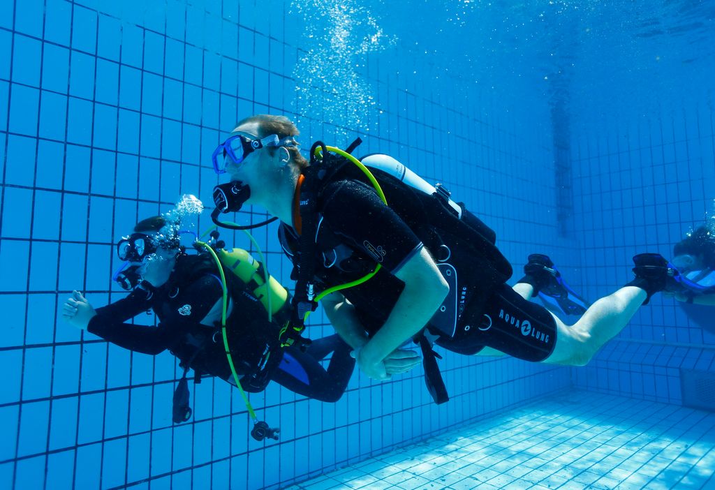 Prince William scuba diving in a swimming pool