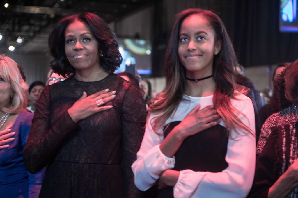 michelle obama and malia with their hands on their chests