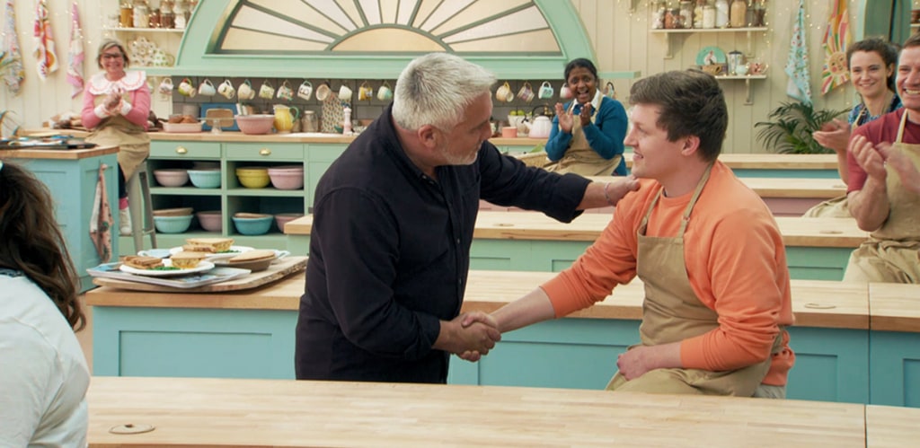 Paul Hollywood gives Josh a handshake in Bake Off