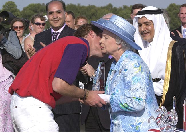 Prince William gives the queen a kiss at the polo