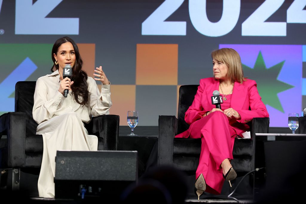 Meghan on stage with katie couric