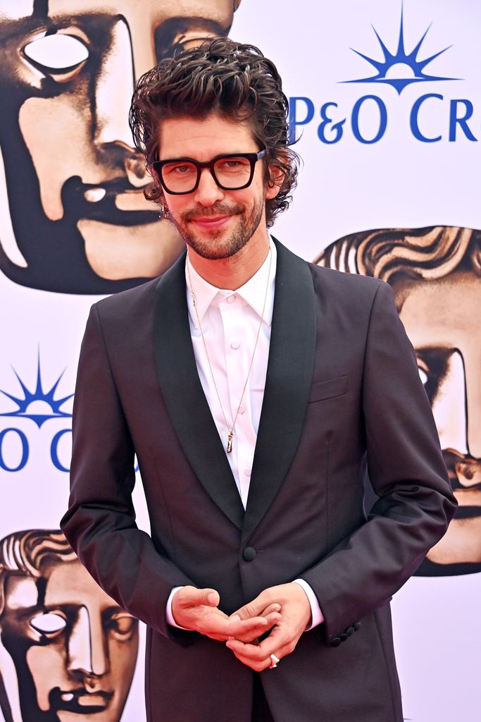 Ben Whishaw looked suave in a plum-hued suit on the red carpet
