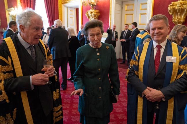 princess anne at the palace wearing green