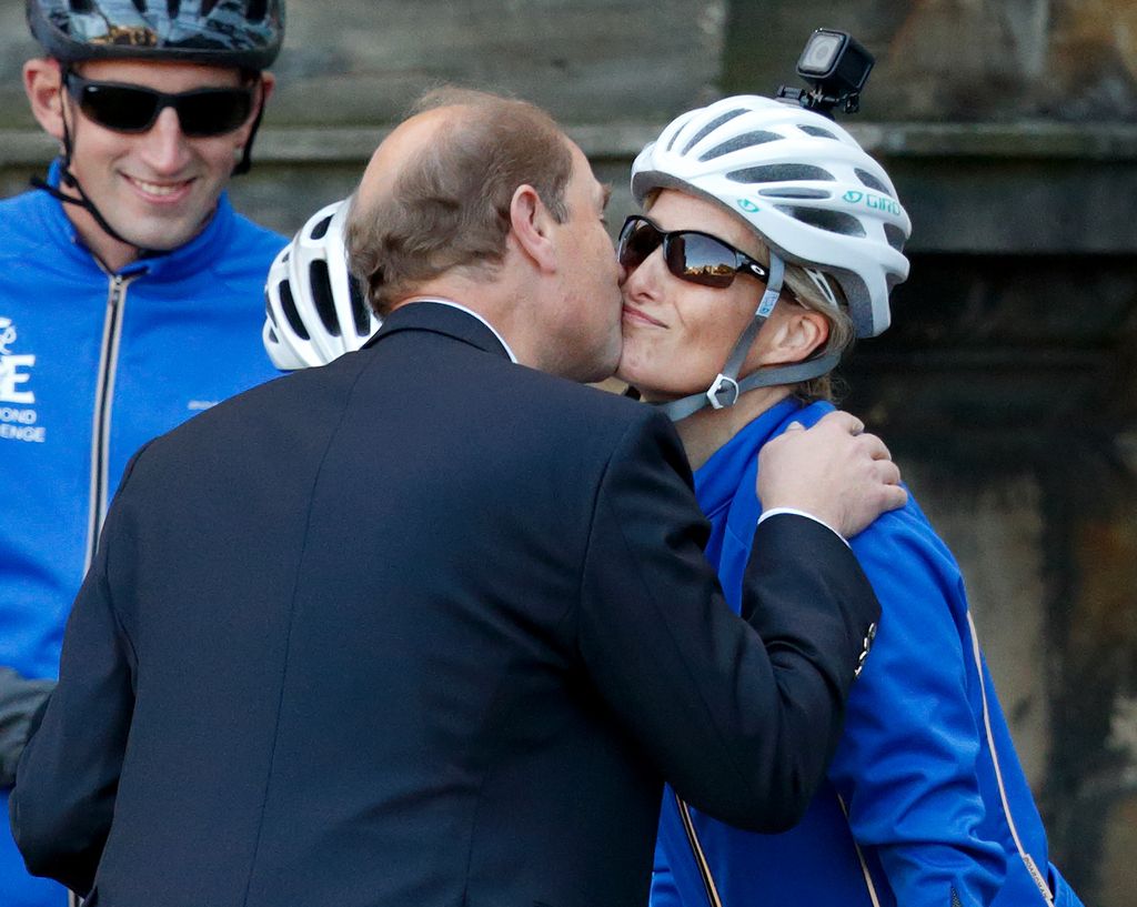 Prince Edward kisses wife Sophie after cycling challenge