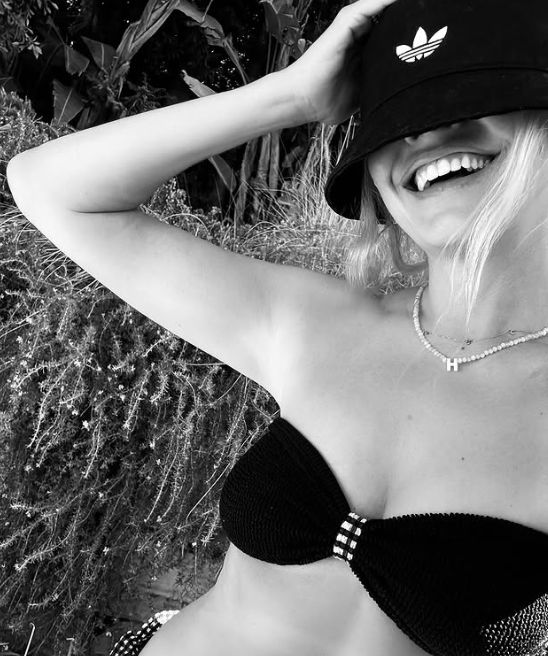Black-and-white photo of Holly Willoughby in a black bikini