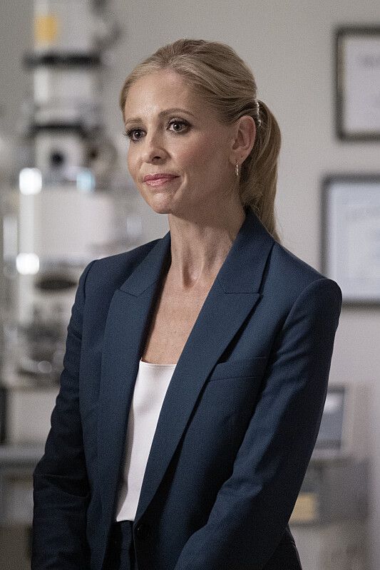 blonde woman in suit