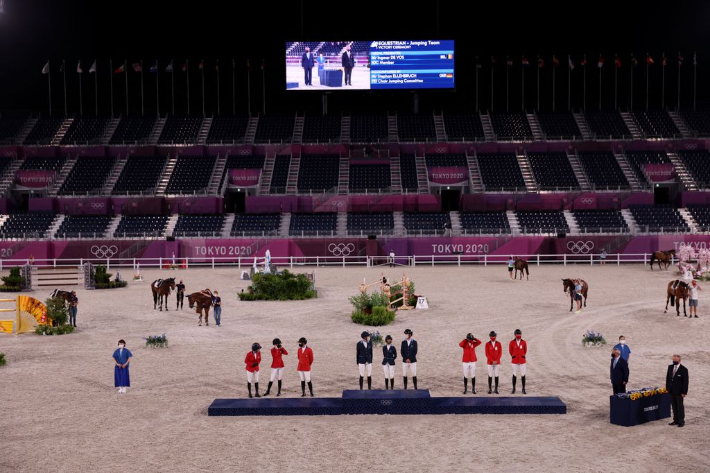 (FromL) Silver medalists of the US team, Laura Kraut, Jessica Springsteen and McLain Ward, gold medalists of Sweden Henrik von Eckermann, Malin Baryard-Johnsson and Peder Fredricson and bronze medalists of Belgium Pieter Devos, Jerome Guery and Gregory Wathelet pose on the podium of the equestrian's jumping team during the Tokyo 2020 Olympic Games at the Equestrian Park in Tokyo on August 7, 2021. (Photo by Behrouz MEHRI / AFP) (Photo by BEHROUZ MEHRI/AFP via Getty Images)