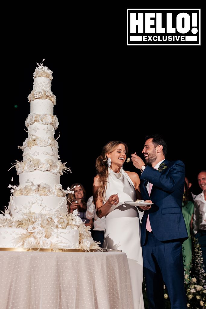 The couple's seven tier wedding cake was crafted by Bruno Gomes of Catering Champs. They cut the cake to a romantic serenade from the 50-strong orchestra and beneath a glittering firework display