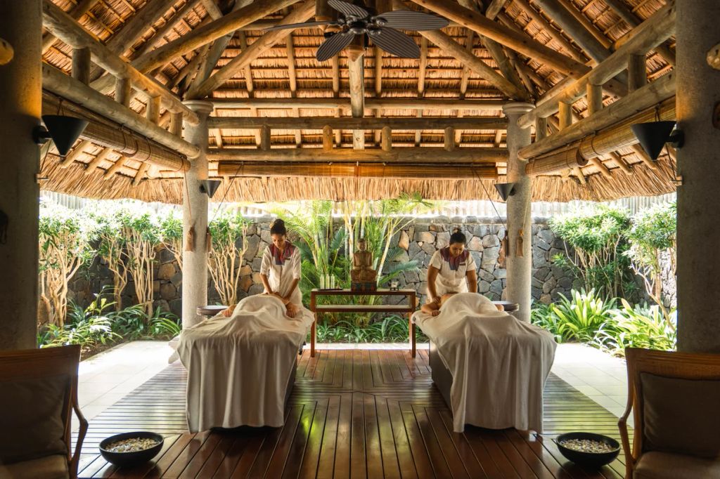 two people having massages in an open air spa