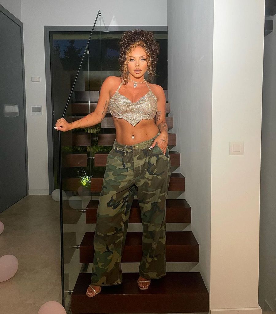 jesy nelson camo trousers crop top posing on staircase
