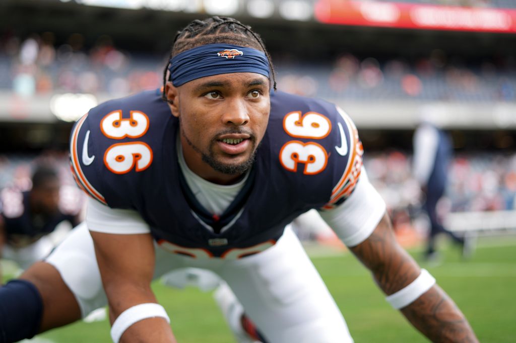 Jonathan Owens #36 of the Chicago Bears stretches on the field prior to an NFL preseason football game against the Cincinnati Bengals, at Soldier Field on August 17, 2024 in Chicago, Illinois.