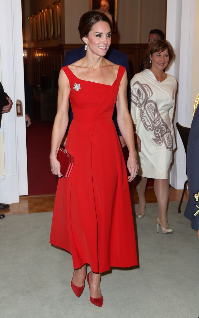 Catherine in red dress and heels