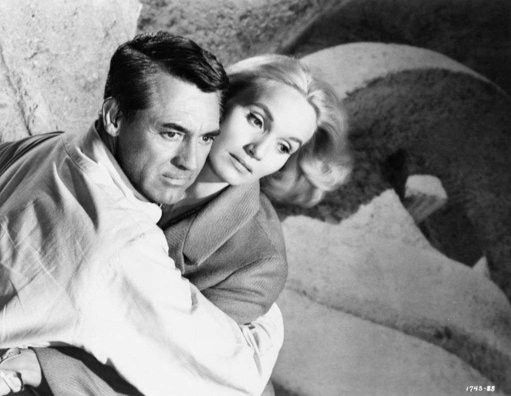Cary Grant as Roger Thornhill and Eva Marie Saint as Eve Kendall in Alfred Hitchcock's 1959 thriller North by Northwest. (Photo by ï¿½ï¿½ John Springer Collection/CORBIS/Corbis via Getty Images)