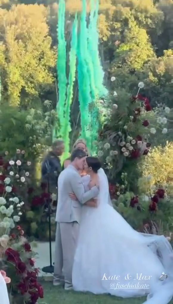 colourful canons behind kissing couple
