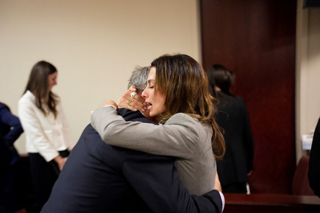 US actor Alec Baldwin and his wife Hilaria Baldwin embrace during his trial on involuntary manslaughter 