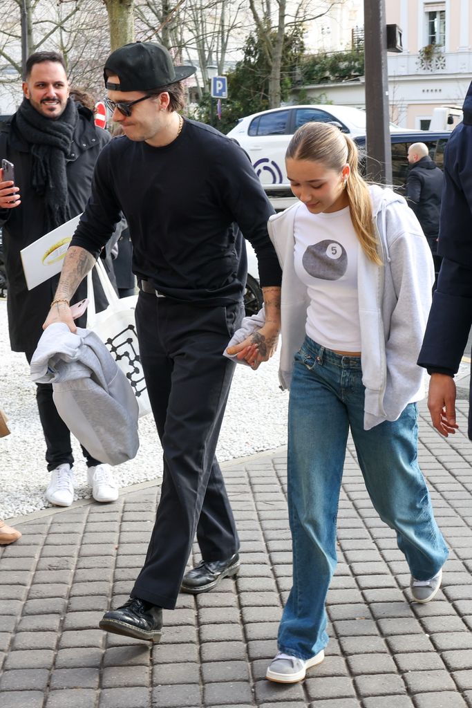 Brooklyn and Harper Beckham holding hands looking casual in Paris