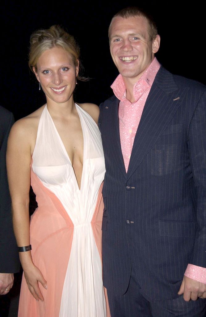 Zara Tindall in a pink sheer dress with Mike Tindall