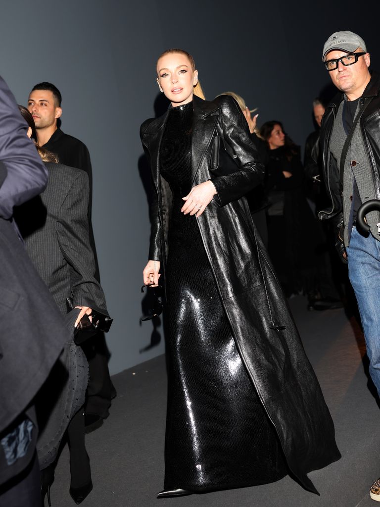 Lindsay Lohan walking in black leather coat