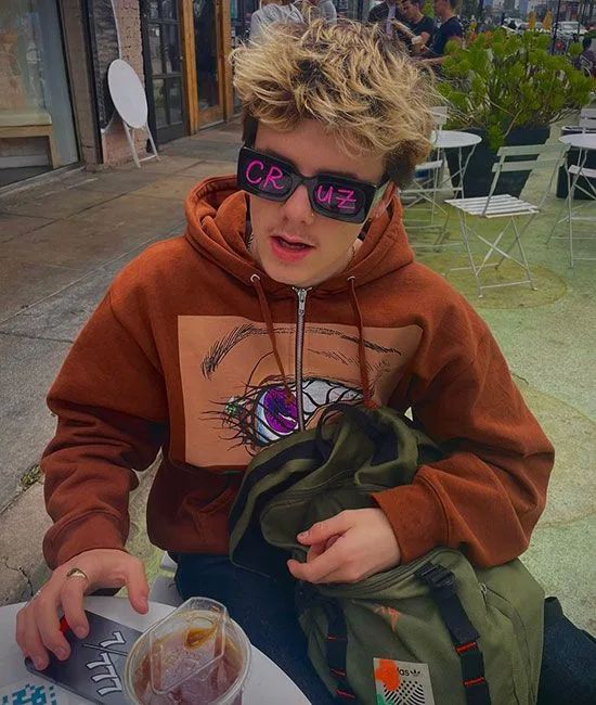 cruz beckham in orange hoodie