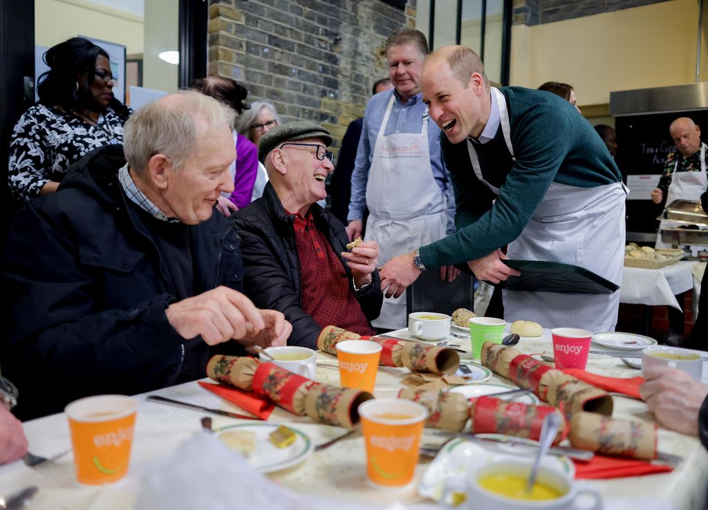 William helping to serve meals at The Passage