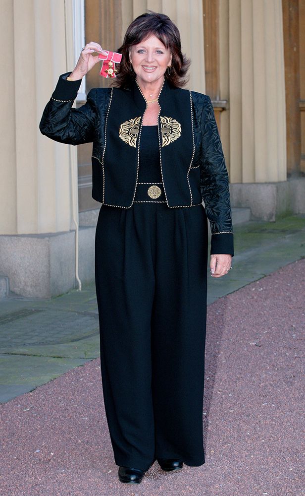 Margaret Miles-Bramwell pictured with her OBE for services to the health of the British public