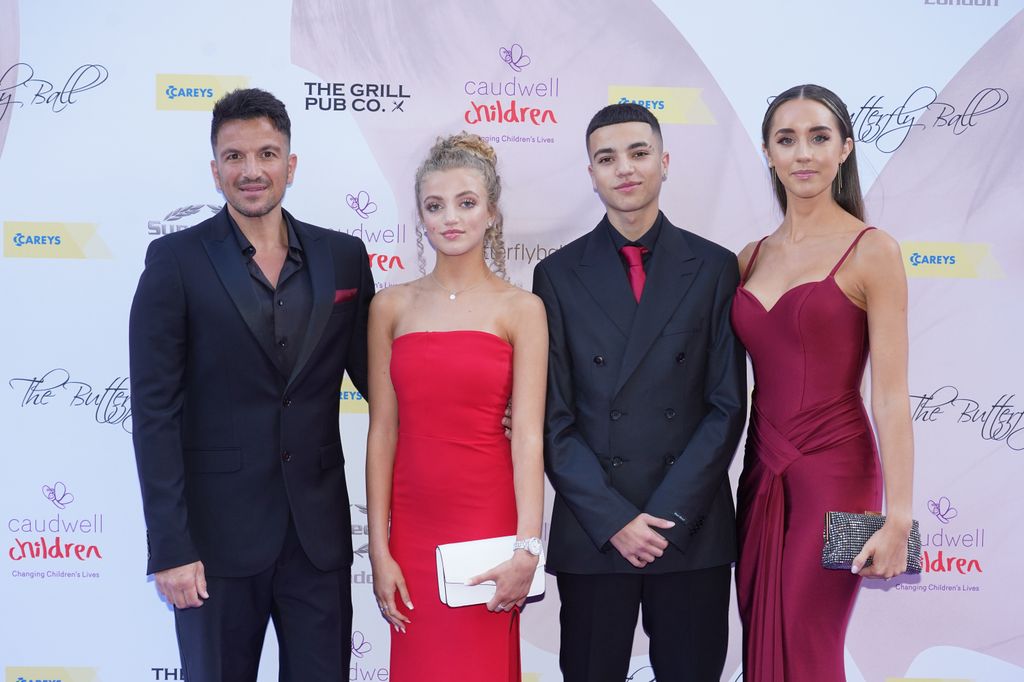 Junior on red carpet with his dad, stepmum, and sister Princess