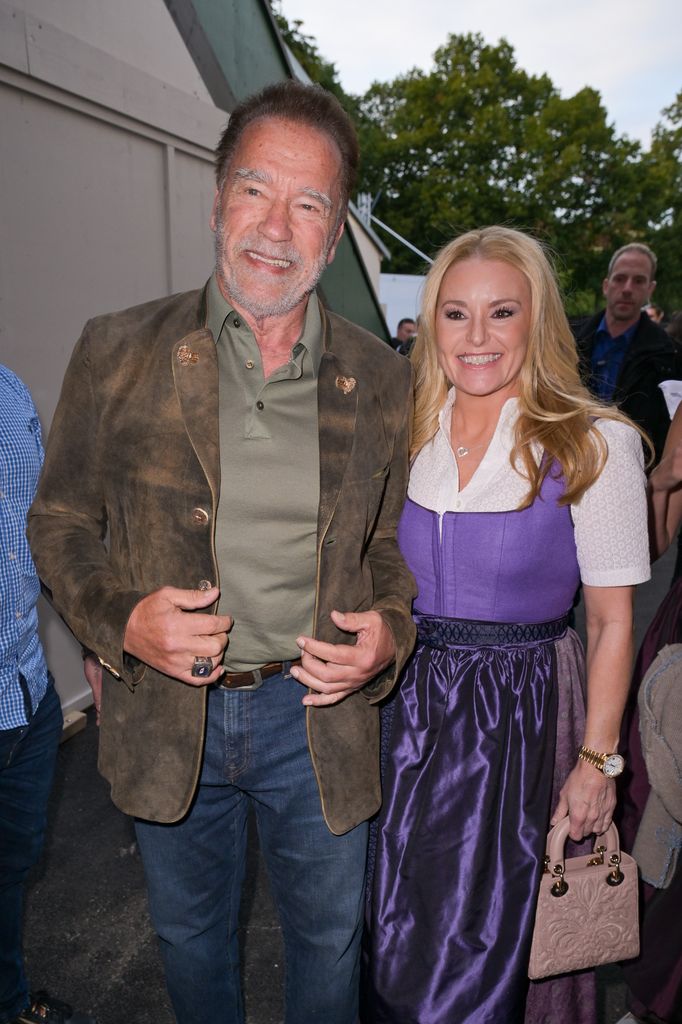 Arnold Schwarzenegger and Heather Milligan attend the 188th Oktoberfest at Marstall tent on September 23, 2023 in Munich, Germany