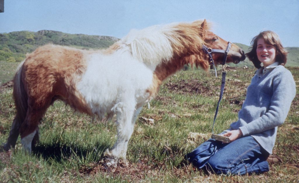 A Shetland pony nuzzling a young Princess Diana