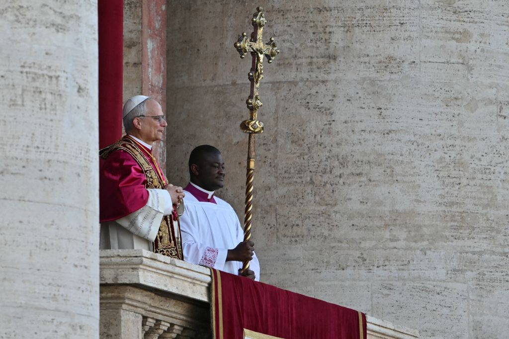 Newly elected Pope Robert Francis Prevost arrives on the main central loggia balcony of the St Peter's Basilica for the first time