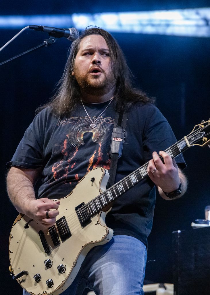 photo of wolfgang van halen playing guitar on stage