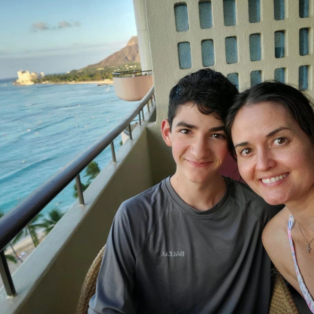 photo of danica mckellar and son on balcony overlooking sea