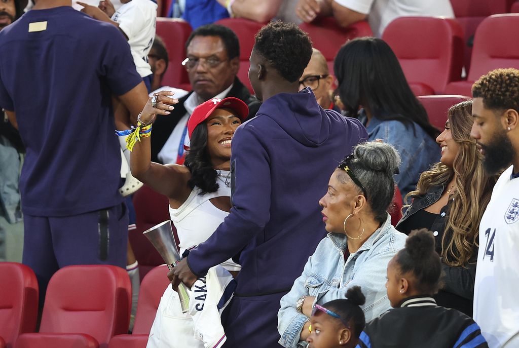 The pair looked smitten as they shared an embrace following England's win against Switzerland 