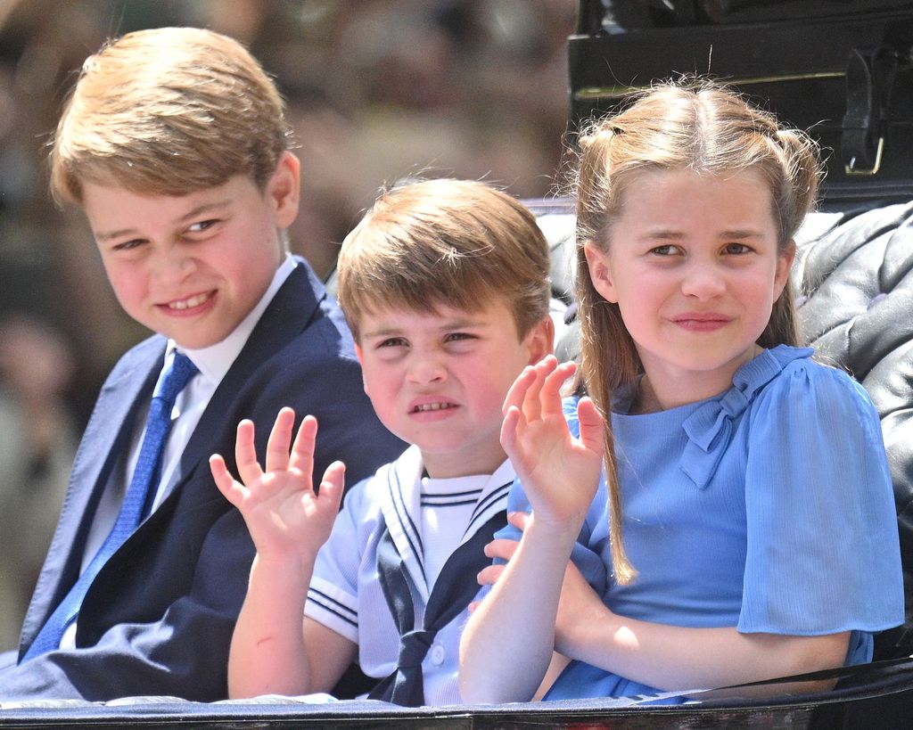 Prince George of Cambridge, Prince Louis of Cambridge and Princess Charlotte of Cambridge ride in a carriage during Trooping The Colour