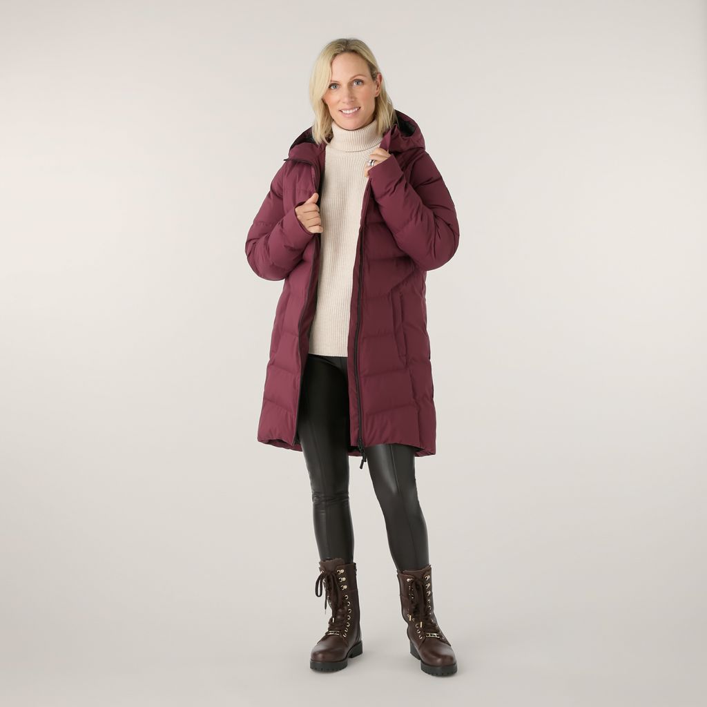 Zara Tindall wears a burgundy puffer jacket
