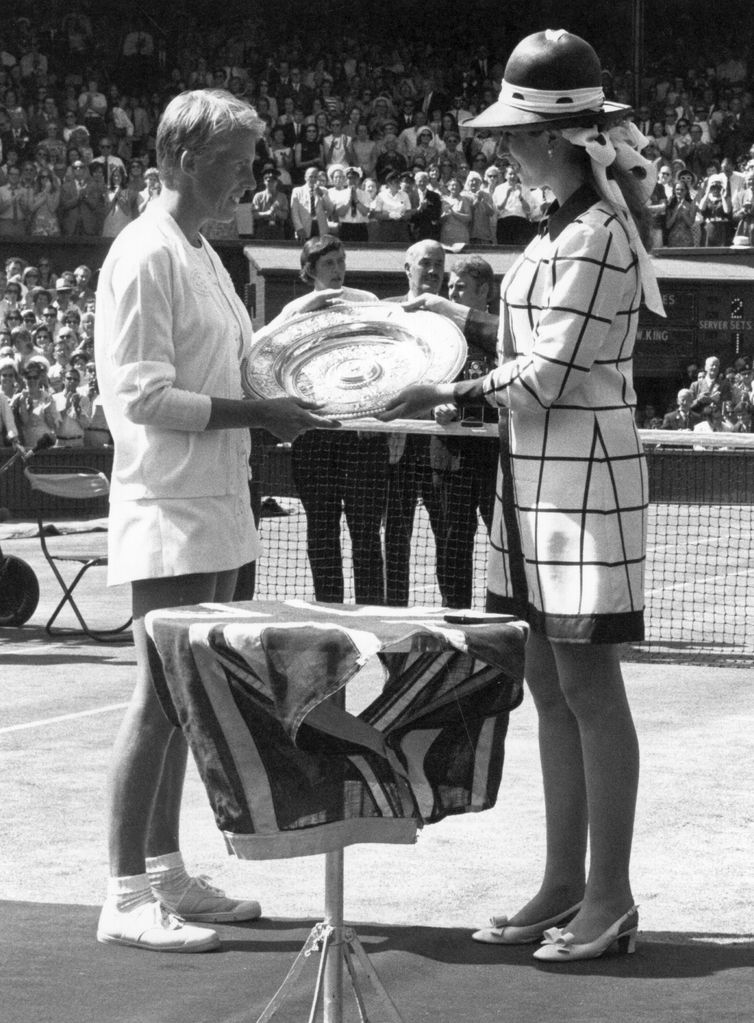  English tennis player Ann Jones (nee Haydon) being presented with the trophy by Princess Anne after beating Billie Jean King of the USA