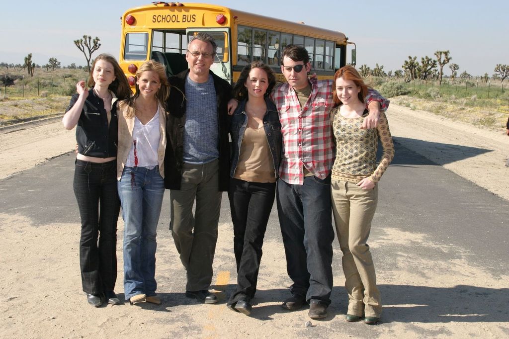 Michelle Trachtenberg, Sarah Michelle Gellar, Tony Hrad, Eliza Dushka, Nicolas Brendan and Alyson Hannigan in scene from final episode of Buffy