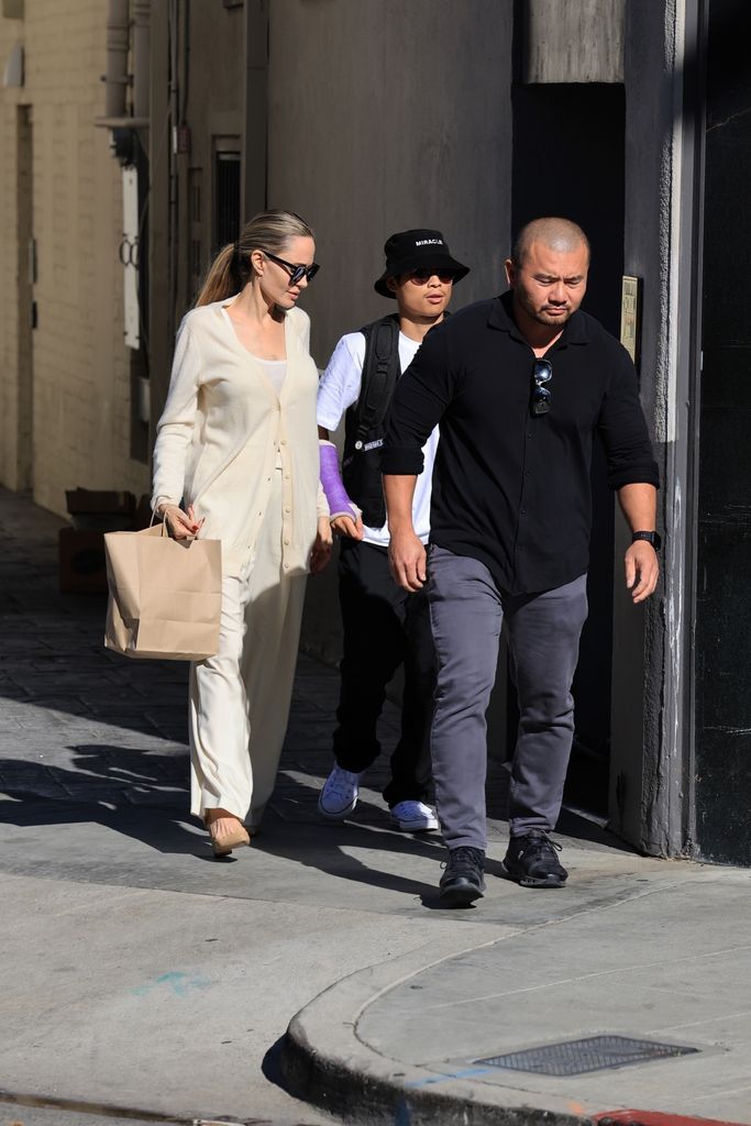 Pax  Jolie-Pitt is seen for the first time grabbing lunch with Angelina Jolie after his e-bike accident in Beverly Hills