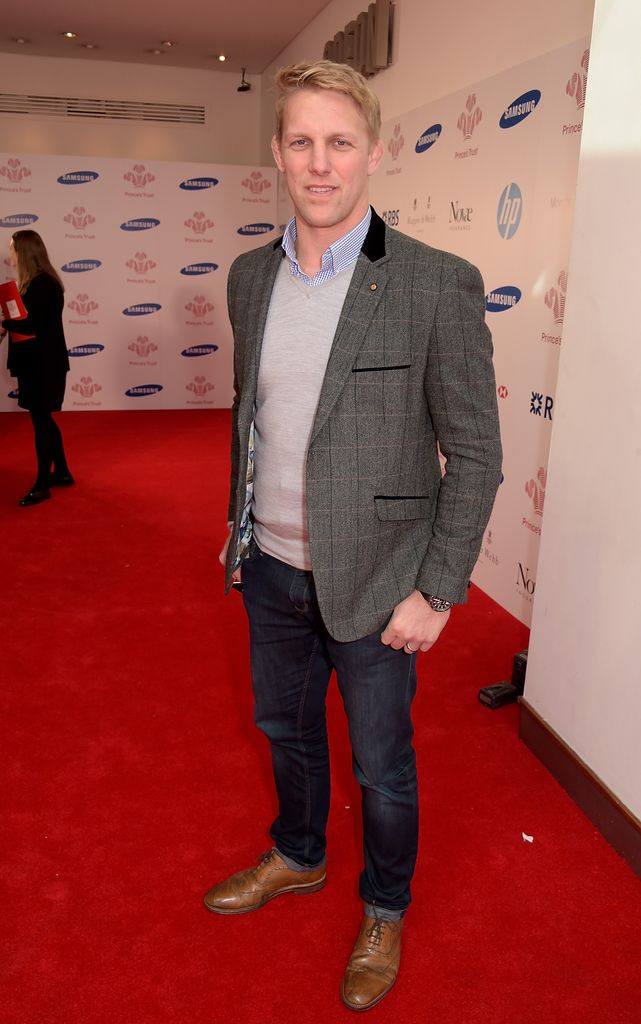 Lewis Moody on the red carpet in a dark jacket