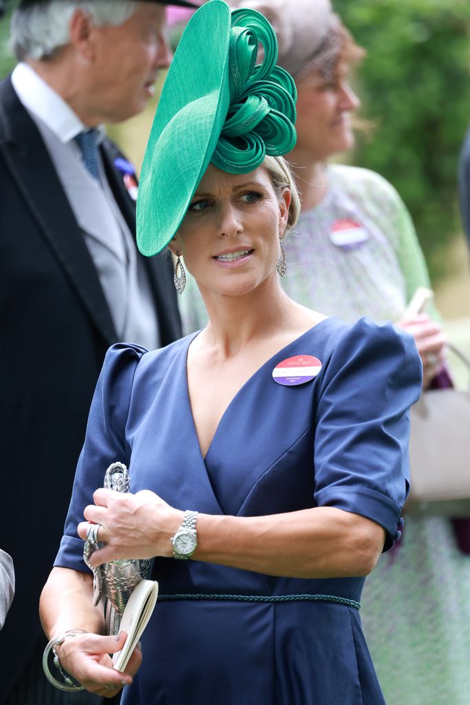 Zara Tindall wore a puff-sleeved blue dress and emerald green hat