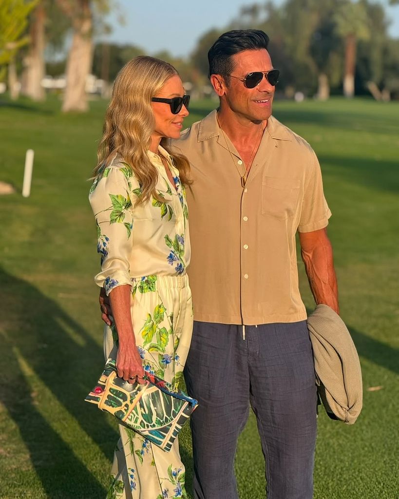 Kelly Ripa wears silky floral ensemble as she posed with husband Mark on golf course