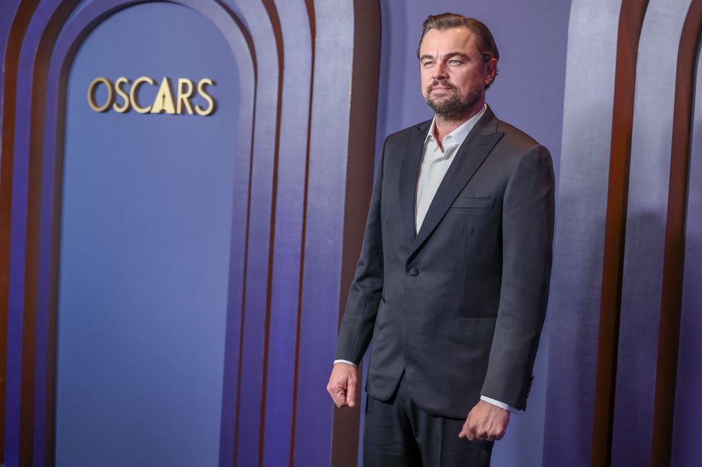 Leonardo DiCaprio in a grey suit without a tie