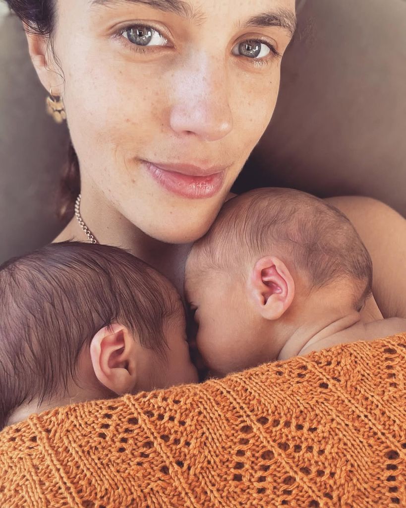 Jessica Brown Findlay with her newborn sons on her chest