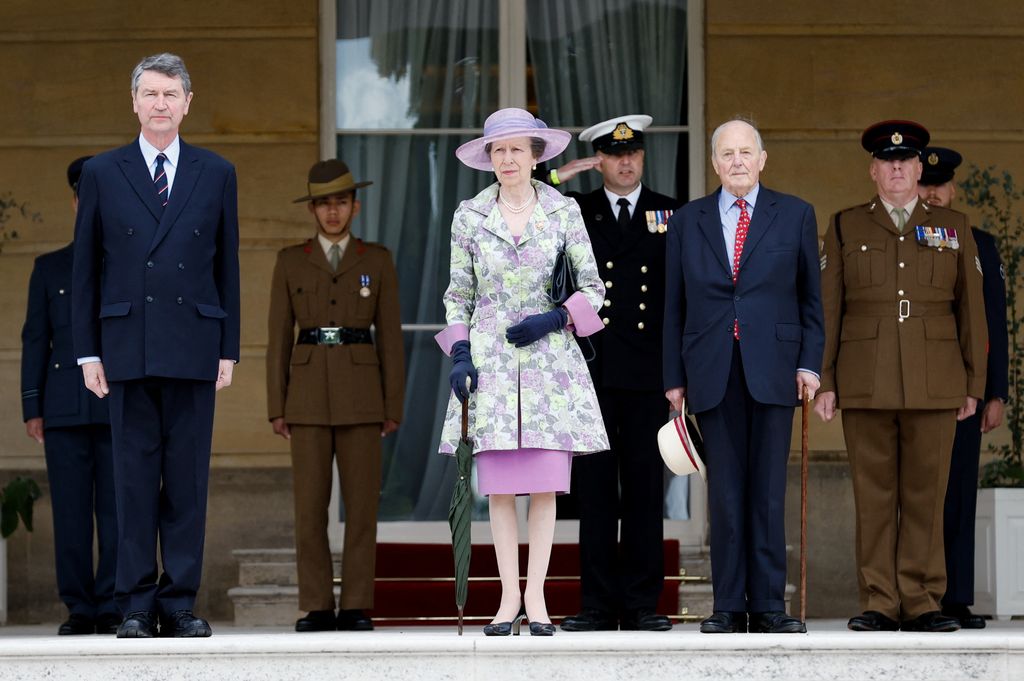Princess Anne, Princess Royal arrives with Vice Admiral Sir Timothy Laurence (L) to attend the Not Forgotten Association Garden Party at Buckingham Palace on May 12, 2022 in London