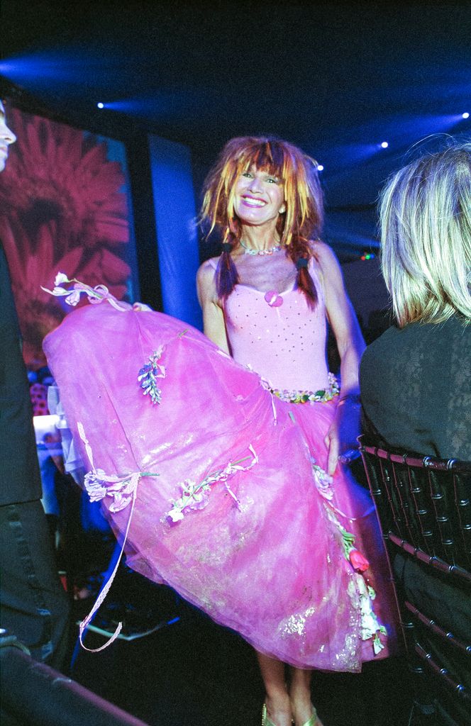 Portrait of American fashion designer Betsey Johnson as she attends the 18th annual CFDA Fashion Awards, held at the 69th Regiment Armory, New York, New York, June 2, 1999