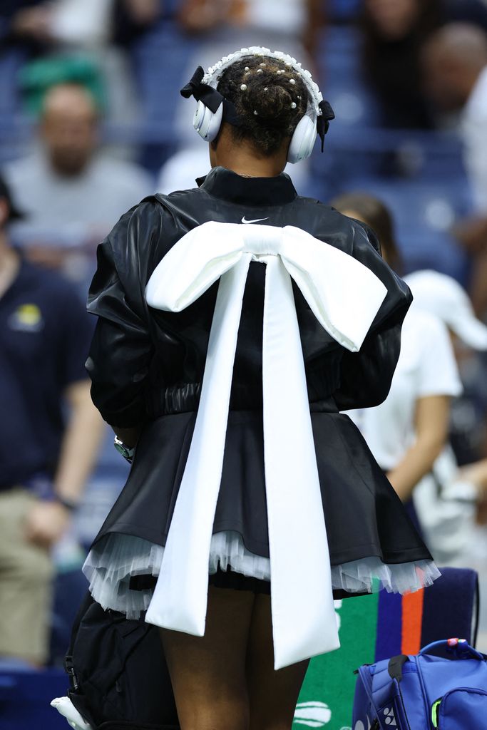  Naomi Osaka arrives on court for her women's singles second round tennis match against Czech Republic's Karolina Muchova on day four of the US Open tennis tournament at the USTA Billie Jean King National Tennis Center in New York City, on August 29, 2024. (Photo by CHARLY TRIBALLEAU / AFP) (Photo by CHARLY TRIBALLEAU/AFP via Getty Images)